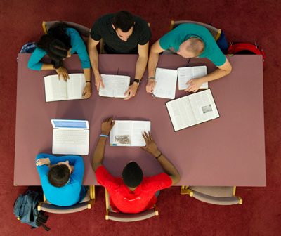 students at a library study table