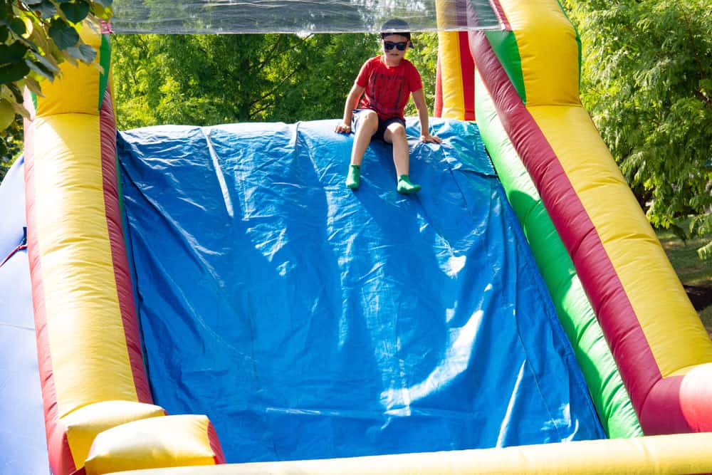 Child playing on inflatable course