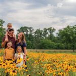 the Jones family standing in a field of flowers