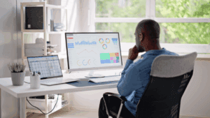 A picture of a data graduate working on data analytics.